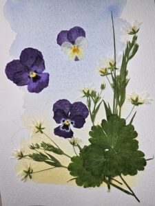 Mixed-Media-Bild: getrocknete Blüten arrangiert